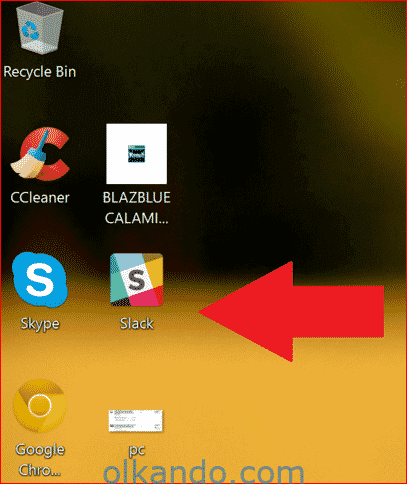 Windows masaüstü. Uygulama simgelerinin sol alt köşesinde kısayol oku artık görünmüyor; kırmızı ok Slack simgesini işaret ediyor.